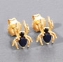 spider earrings with sapphire and black spinel gemstones in 18k yellow gold over sterling silver on gray background