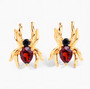 front view of spider stud earrings with garnet and black spinel in 18k yellow gold over sterling silver
