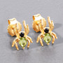 peridot and black spinel spider stud earrings in 18k yellow gold over sterling silver on gray background