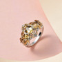 angled view of honey scapolite oval five stone ring in two-tone 18k yellow gold and rhodium over sterling silver