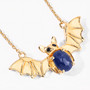 angled view of bat necklace oval with sapphire and black spinel in 18k yellow gold over sterling silver