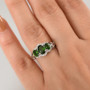 chrome diopside and zircon halo trilogy ring worn on hand showing gemstone brilliance and size