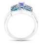 side profile view showing raised tanzanite centerpiece and detailed turquoise enamel pattern on sterling silver ring