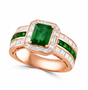 angled front view of emerald cut emerald ring with diamond halo and channel set diamonds in 14k rose gold
