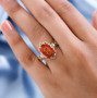 orange kyanite cluster ring worn on hand displaying vivid orange brilliance