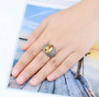 citrine and white zircon statement ring in 18k yellow gold over sterling silver worn on a hand