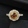 angled view of bronze diaspore yellow sapphire and moissanite double halo ring in 18k yellow gold over sterling silver