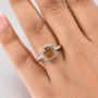 bronze diaspore and diamond asscher cut halo ring in 10k yellow gold worn on a hand