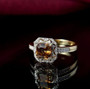 angled view of bronze diaspore and diamond asscher cut halo ring in 10k yellow gold