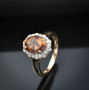 angled view of bronze diaspore and diamond oval scalloped halo ring in 10k yellow gold