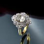 turkish diaspore and moissanite halo ring in rhodium and 18k yellow gold over solid 925 sterling silver shown in a lifestyle photo