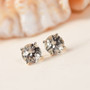 Pair of Turkish Diaspore Round Stud Earrings in 10k yellow gold, featuring brilliant 1.50ctw color-shifting diaspores in classic four-prong settings