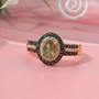 close up of demantoid tsavorite garnet and moissanite double halo ring in 18k yellow gold over sterling silver