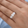 australian white opal five stone ring in rhodium over solid 925 sterling silver worn on a hand