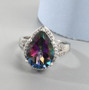 display image of mystic topaz and white zircon pear halo ring in rhodium over sterling silver highlighting vivid rainbow topaz center and bright zircon accents
