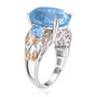 side view of sky blue oval topaz trilogy ring in 18k yellow gold and rhodium over 925 sterling silver