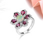 opal and rhodolite garnet flower ring in rhodium over sterling silver shown in a lifestyle photo