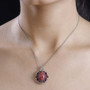 thulite and rhodolite halo pendant necklace in two-tone 18k yellow gold and rhodium over sterling silver worn around the neck