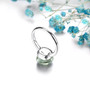 close up of prasiolite invisible set solitaire ring in rhodium over sterling silver