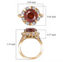 sphalerite and lab diamond sunburst halo ring in 10k yellow gold shown for size comparison