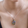 atlantisite and multi gem halo pendant necklace in rhodium over sterling silver worn around the neck