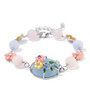angled view of aquamarine and morganite cabochon and enamel bird garden bracelet in rhodium over silver