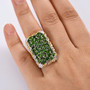 chrome diopside cluster ring in two-tone 18k yellow gold and rhodium over sterling silver worn on a hand
