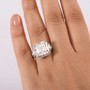 moissanite emerald cut ring in rhodium over sterling silver worn on hand showing bold size and radiant sparkle moissanite emerald cut ring in rhodium over sterling silver worn on hand showing bold size and radiant sparkle