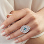 blue zircon and moissanite cluster ring worn on hand showing bold geometric sparkle in rhodium plated silver blue zircon and moissanite cluster ring worn on hand showing bold geometric sparkle in rhodium plated silver