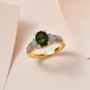 studio display of vesuvianite and moissanite ring highlighting its radiant golden luster, dual row pavé shoulders, and rich green gemstone brilliance studio display of vesuvianite and moissanite ring highlighting its radiant golden luster, dual row pavé shoulders, and rich green gemstone brilliance