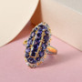 display image of iolite elongated cluster ring featuring deep blue iolite gemstones set in ornate two-tone silver and gold filigree design