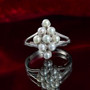 angled shot of the Freshwater Pearl cluster ring showing the reflective rhodium finish and elevated multi-stone setting