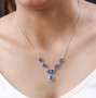 mystic blue petalite and white zircon drop necklace in rhodium over sterling silver worn around the neck