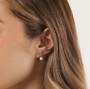 close up of bow and pearl drop earrings with lab grown diamonds in 18k yellow gold over sterling silver