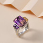 ametrine amethyst and citrine open work euro shank ring displayed on neutral background showing two tone metal and faceted stones