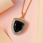 close up of black spinel and white zircon shield cut halo pendant necklace in 18k yellow gold over sterling silver