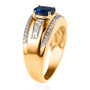 side profile of blue spinel and white zircon gent’s ring showing sleek gold band and prong-set oval stone