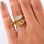 open work white zircon bypass ring in 18k yellow gold over sterling silver worn on a hand