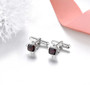 black garnet and white zircon cufflinks in rhodium over sterling silver shown in a lifestyle photo