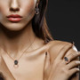 black spinel and lab green spinel leopard jewelry set in 18k rose gold over sterling silver shown being worn