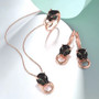 close up of black spinel and lab green spinel leopard jewelry set in 18k rose gold over sterling silver