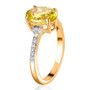 angled view of yellow tourmaline oval and diamond ring in 14k yellow gold