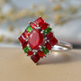 fire opal and chrome diopside cluster ring in rhodium over sterling silver shown in a lifestyle photo