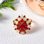 fire opal and ethiopian opal pear cocktail cluster ring in 18k yellow gold over sterling silver shown in a lifestyle photo