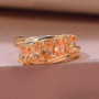 imperial garnet five stone bypass ring in 18k yellow gold over sterling silver shown in a lifestyle photo