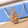 imperial garnet and zircon round infinity pendant necklace in 18k yellow gold over sterling silver shown in a lifestyle photo