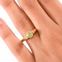 lab yellow diamond round solitaire wedding ring in 10k yellow gold worn on a hand