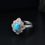full view of turquoise and zircon ring and pendant necklace jewelry set in rhodium over sterling silver