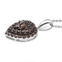 side profile of lab red diamond heart cluster pendant in rhodium over sterling silver with black rhodium tipped prongs