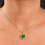 ammolite and moissanite heart halo pendant necklace in 18k yellow gold over sterling silver shown on model’s neck